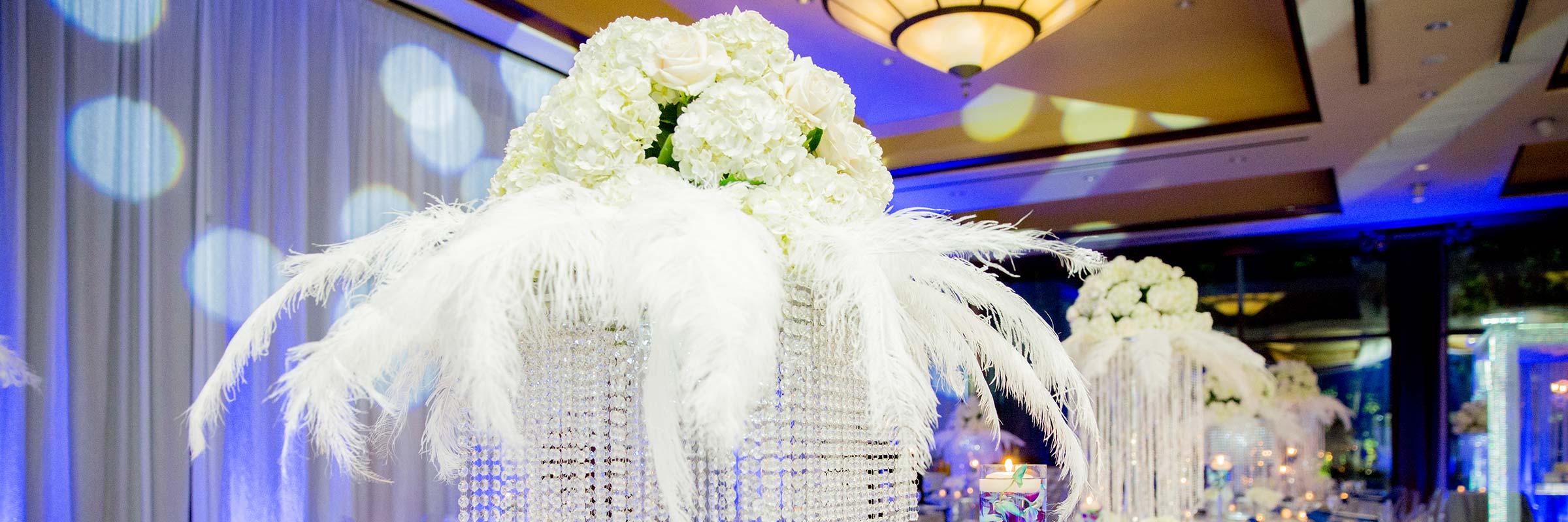 White Floral Arraingement Centerpiece Feathers Crystals