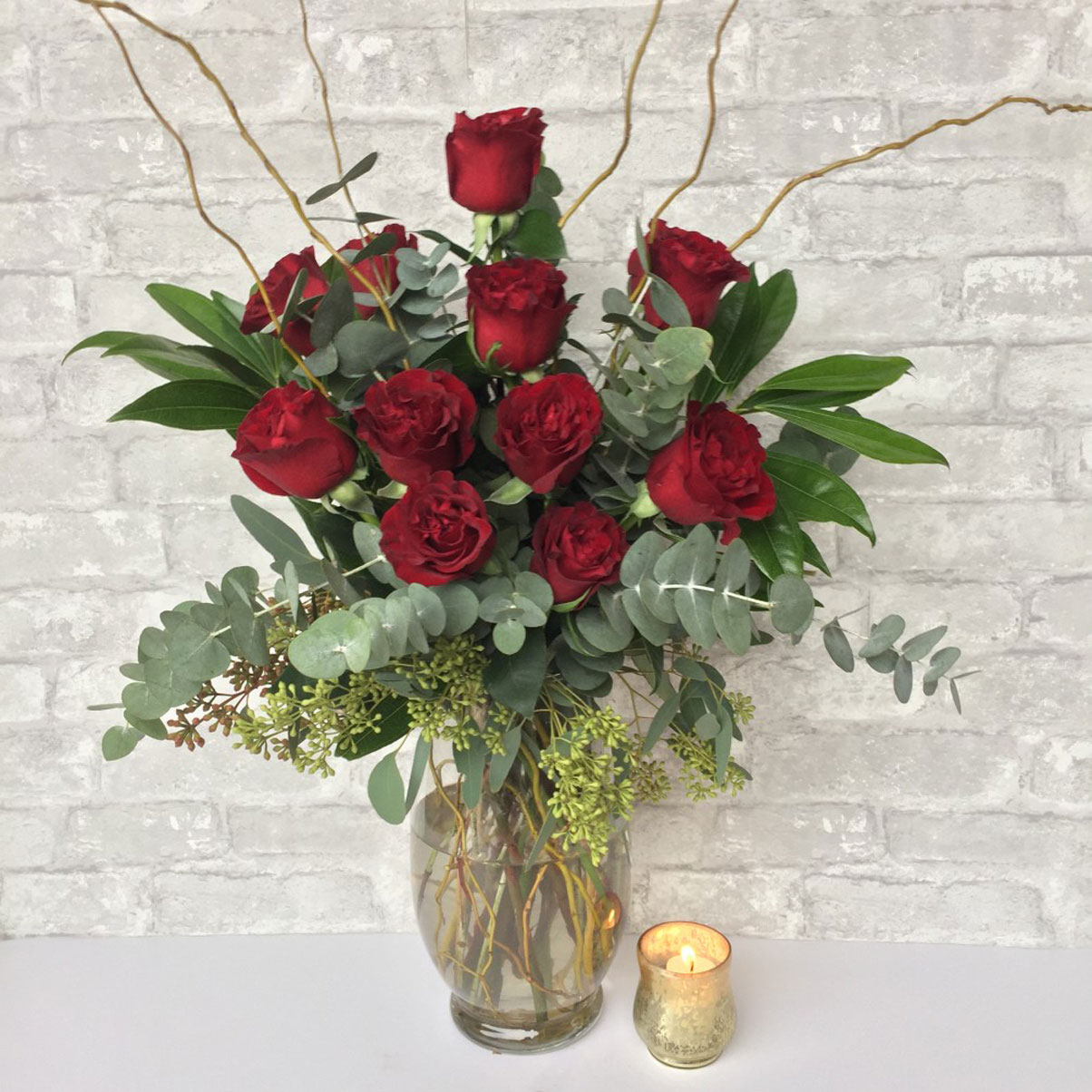 beautiful-vase-flowers-fresh-red-roses-sticks-eucalyptus